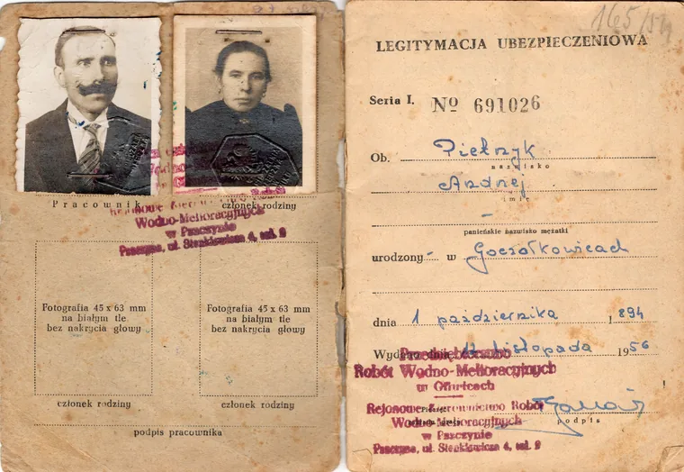 A 1956 Polish insurance identity booklet with two mounted portrait photographs and embossed stamps